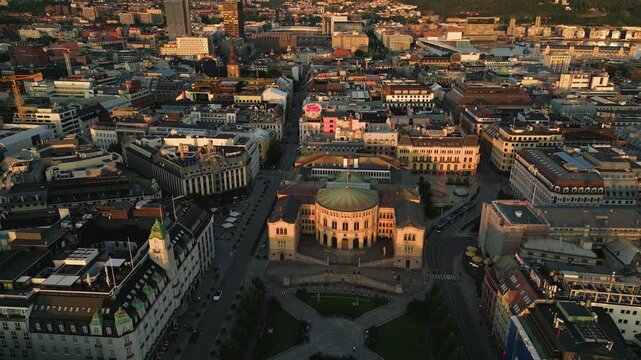 Aerial view of the Stortinget building surrounded by historic urban architecture, city streets, and rooftops in the center of Oslo, Oslo, Norway.