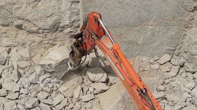 Hydraulic Excavator Breaking Large Limestone Rocks