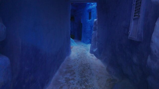 A Serene View Through the Blue-Washed Alleyways of Chefchaouen, Morocco's Enchanting Blue City.
