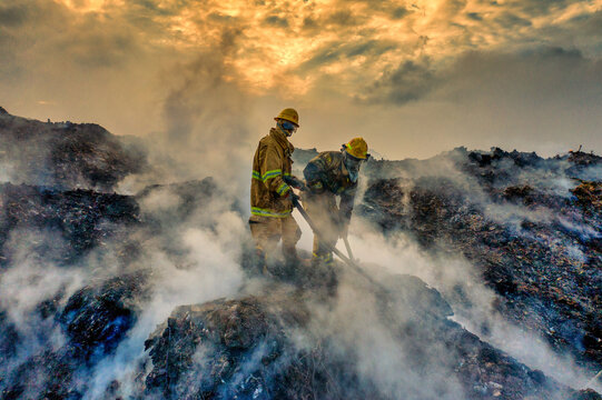 Aerial view of firefighters working to extinguish a fire at the Duquesa Landfill in Pantoja, Santo Domingo, Dominican Republic.