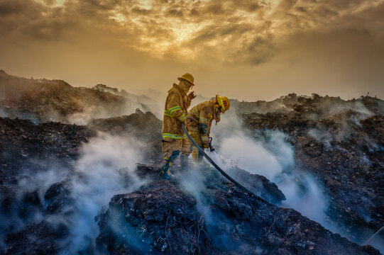 Aerial view of firefighters extinguishing a fire at Vertedero Duquesa in Pantoja, Santo Domingo, Dominican Republic.