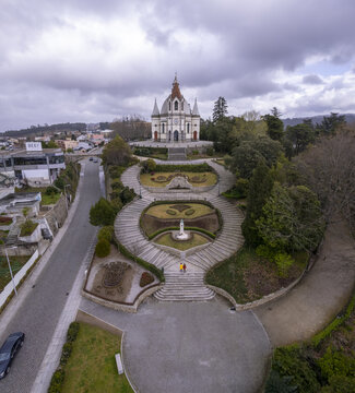 Aerial view of the Sameiro Garden and the Sanctuary of Our Lady of Sameiro, featuring manicured lawns and stone staircases in Penafiel, Porto, Portugal.