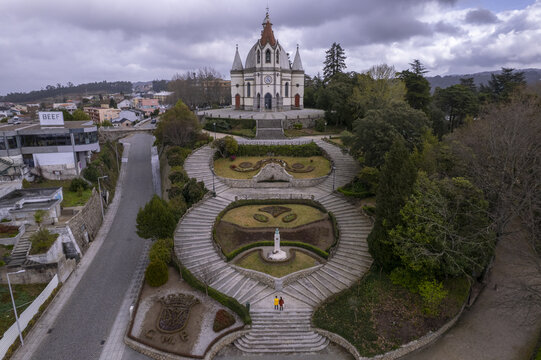 Aerial view of the Sameiro Garden and the Sanctuary of Sameiro featuring ornate stone staircases, manicured lawns, and a historic church in Penafiel, Porto, Portugal.