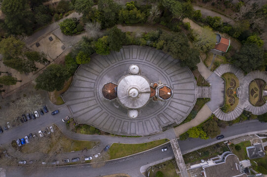 Aerial view of Sameiro Garden with its distinctive circular plaza and historic sanctuary surrounded by lush trees and paved pathways in Penafiel, Porto, Portugal.