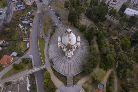 Aerial view of the Sameiro Sanctuary featuring its distinctive dome, surrounding paved plaza, and lush garden pathways in Penafiel, Porto, Portugal.