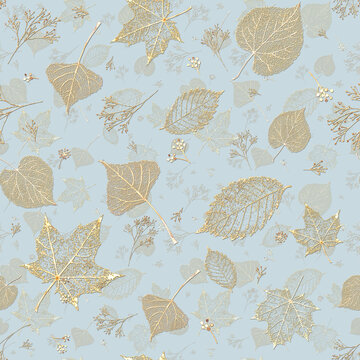 Golden botanical leaves seamless pattern on soft blue background