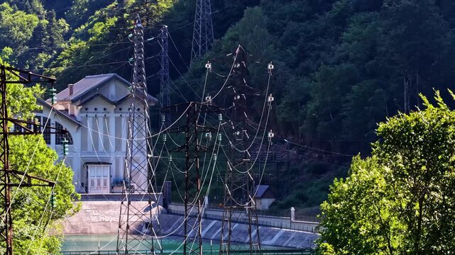 Aerial view of power plant and high-voltage pylons near Col d'Aubisque in Beost, Nouvelle-Aquitaine, France.