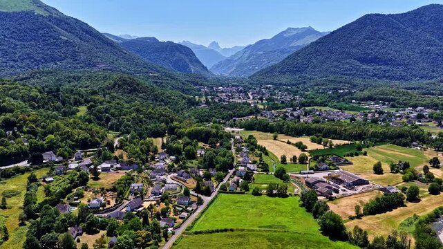 Aerial view of the village of Beost nestled in the lush green valley of the Pyrenees mountains near Col d'Aubisque in Beost, Nouvelle-Aquitaine, France.