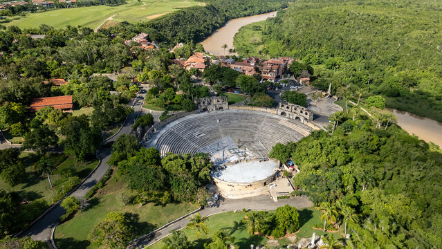 Aerial view of the Altos De Chavon amphitheater surrounded by lush tropical vegetation and the winding Chavon River in La Romana, La Romana Province, Dominican Republic.