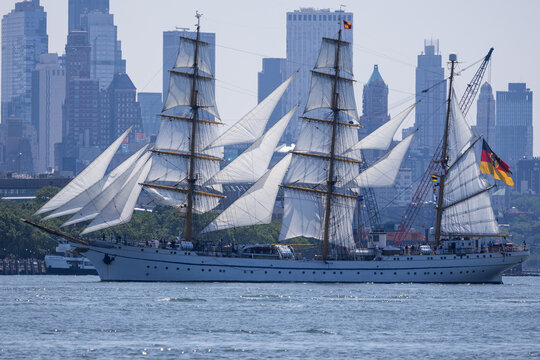 Jersey City, New Jersey, United States - 04 July 2026: View of the tall ship Gorch Fock sailing past the Jersey City skyline near Liberty State Park with white sails unfurled.