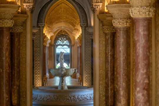 Sintra, Portugal - 14 July 2026: View of the ornate marble fountain and statue inside the Park and Palace of Monserrate, framed by elegant columns and intricate architectural details.