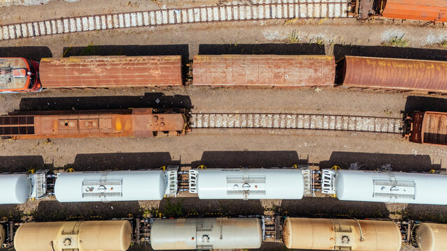 Aerial view of freight train cars parked on parallel tracks in a rail yard in Novi Sad, Vojvodina, Serbia.