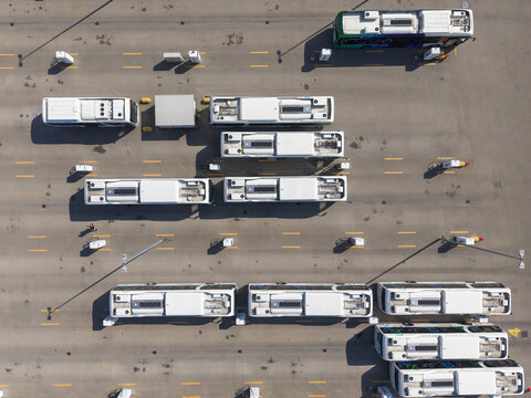 Aerial view of EBS RRReis Stalling Zwolle with multiple buses parked in rows at the charging station facility in Zwolle, Overijssel, Netherlands.