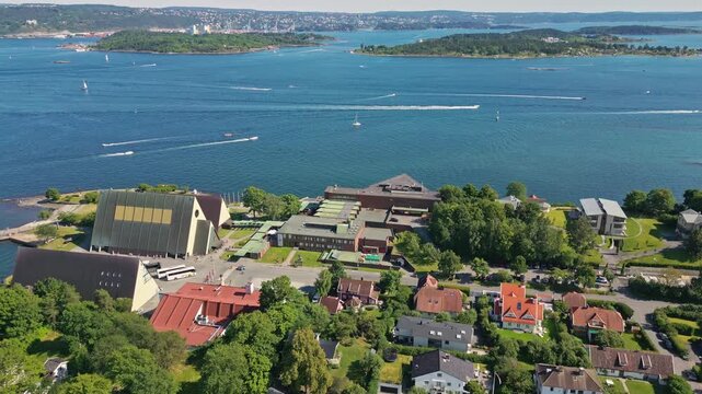 Aerial view of Bygdoy peninsula featuring the Fram Museum and Kon-Tiki Museum surrounded by lush greenery and the blue waters of the Oslofjord in Oslo, Oslo, Norway.