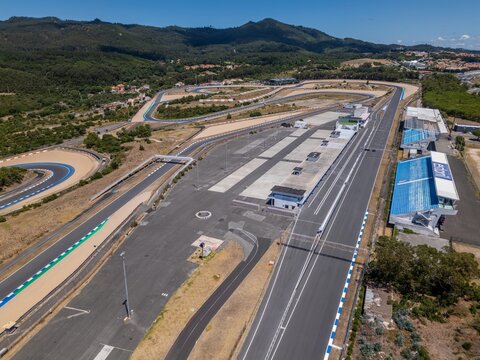 Alcabideche, Portugal - 16 July 2026: Aerial view of Autodromo Fernanda Pires da Silva, featuring the asphalt track, grandstands, and surrounding hilly landscape under a clear sky.