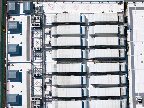 Aerial view of the ATOS data center roof featuring rows of industrial cooling units and HVAC infrastructure in Birmingham, England, United Kingdom.