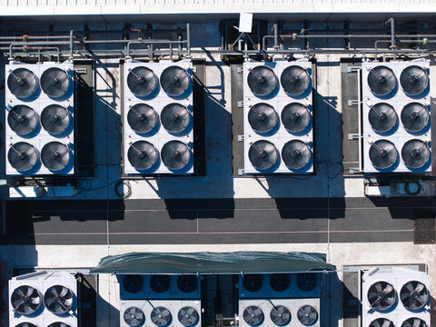 Aerial view of industrial HVAC cooling ventilation units on the roof of the Six Degrees Data Centre in Studley, England, United Kingdom.