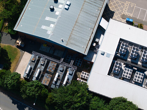 Aerial view of the Six Degrees Data Centre featuring industrial HVAC cooling ventilation units on the roof in Studley, England, United Kingdom.