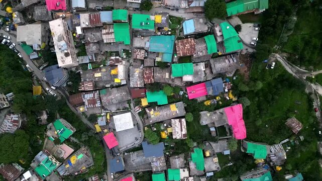 Aerial view of the colorful rooftops and narrow streets of the mountain town of Manali, Himachal Pradesh, India.