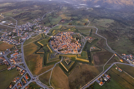 Aerial view of the historic star-shaped fortress of Almeida surrounded by stone walls and rural landscape in Almeida, Guarda District, Portugal.