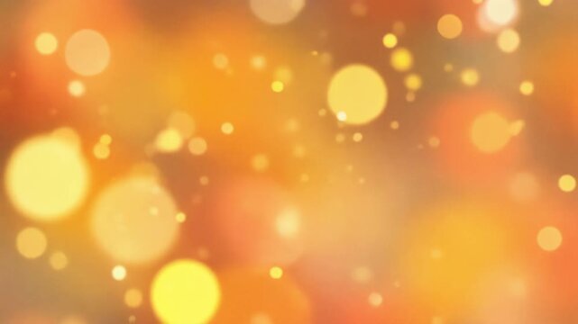Abstract warm bokeh background with glowing orange and yellow light circles