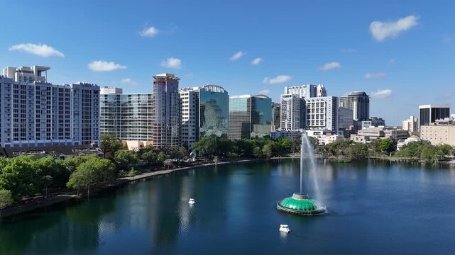 High rises in the background at the fountain in Lake Eola at downtown Orlando in Orange County, Florida.
