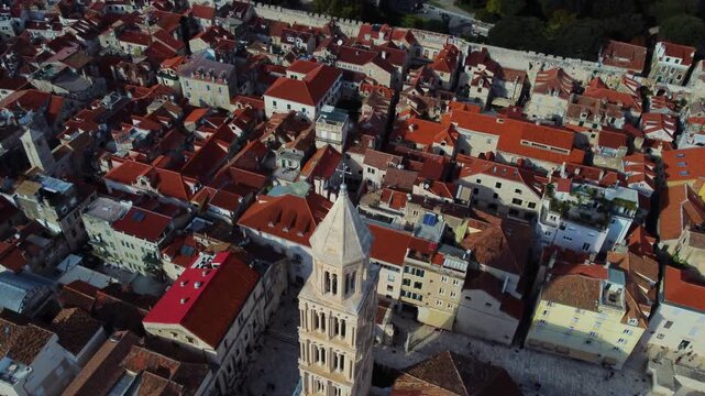 Aerial view of Saint Domnius Cathedral surrounded by historic red-tiled rooftops and stone architecture in the old town of Split, Splitsko-dalmatinska, Croatia.