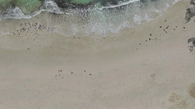 Aerial view of Haukland Beach with white sand and turquoise waves in Leknes, Nordland, Norway.