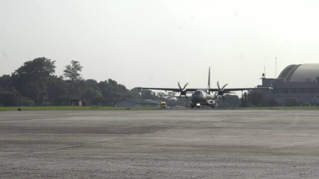 A Hercules aircraft is preparing for takeoff at an airport