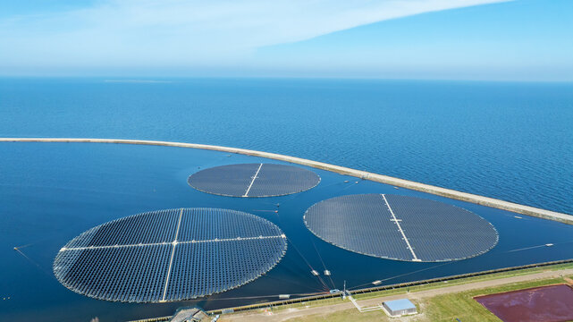 Aerial view of Innovative Sun-Tracking Floating Solar Farm at Andijk Drinking Water Reservoir, Netherlands