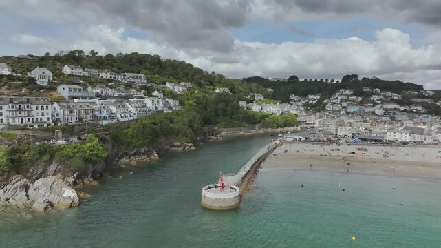 Beach and Cliffs over Looe Bay from a drone, Looe, River Looe Cornwall, England