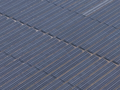 Aerial view of a large solar farm with rows of photovoltaic panels arranged in a grid pattern in Gaibandha, Rangpur Division, Bangladesh.