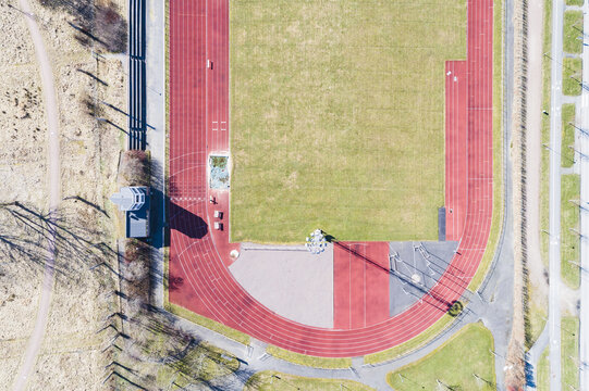 Aerial view of Aby Arena featuring a red running track and green field in Molndal, Vastra Gotalands lan, Sweden.