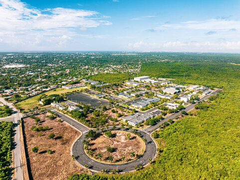 Aerial view of Base de Infanteria de Marina Valm. Manuel Ramon Montes Arache, A.R.D. with military buildings, a roundabout, and greenery in Boca Chica, Santo Domingo, Dominican Republic.