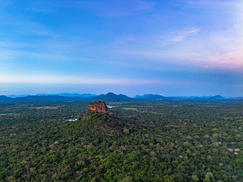 Aerial view of Sigiriya Lion Rock rising above the dense jungle canopy, Sigiriya, Central Province, Sri Lanka.