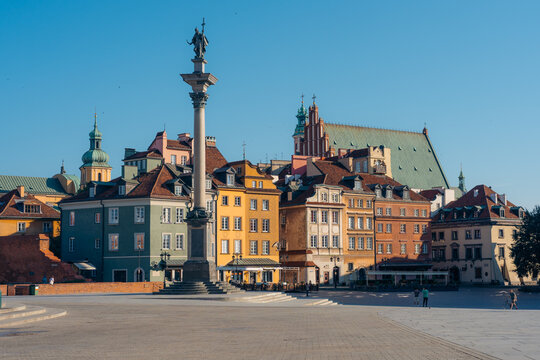 View of Sigismund's Column in the historic Castle Square surrounded by colorful architecture in Warsaw, Masovian Voivodeship, Poland.
