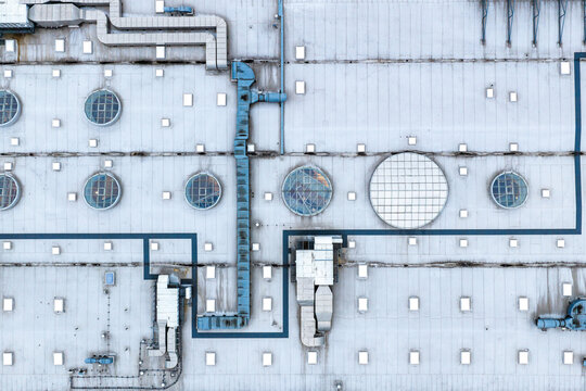 Aerial view of the roof of CH Targowek shopping center featuring circular skylights, ventilation ducts, and HVAC systems in Warsaw, Masovian Voivodeship, Poland.