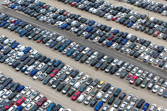 Ciemno-Gnojna, Poland - 11 July 2026: Aerial view of CAT Mosolf Polska Sp. z o.o. featuring rows of parked new vehicles in a large distribution lot.