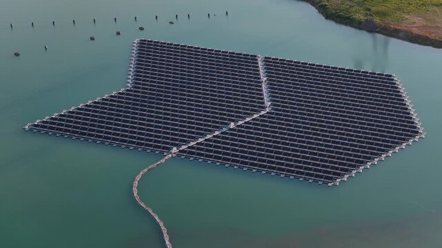 Aerial view of the floating solar park on a lake, showcasing renewable energy infrastructure in Bensheim, Hessen, Germany.