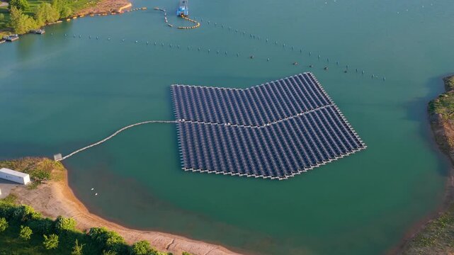 Aerial view of floating solar panels on a lake in Bensheim, Hessen, Germany.