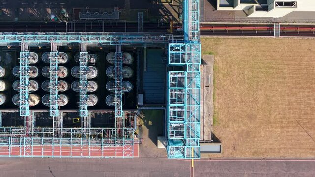 Aerial view of Humber Innovation Park showing industrial storage tanks and blue metal structures at the facility in Grimsby, England, United Kingdom.