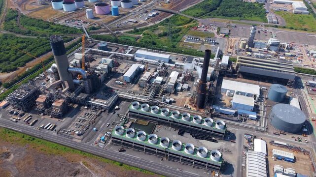Aerial view of VPI Immingham power plant with cooling water intakes and industrial infrastructure in South Killingholme, England, United Kingdom.