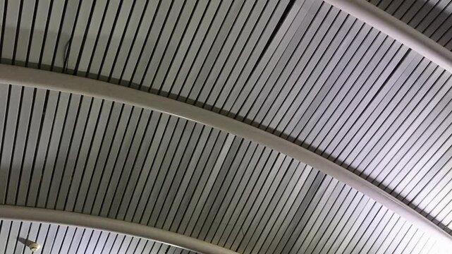 Modern linear ceiling panel architecture design inside contemporary building interior space