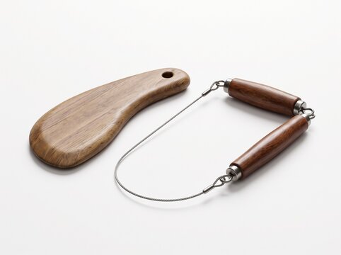 Elegant wooden handle cheese slicer and wire cutter with a separate spreading tool, captured in a clean studio shot perfect for culinary applications and home kitchen essentials
