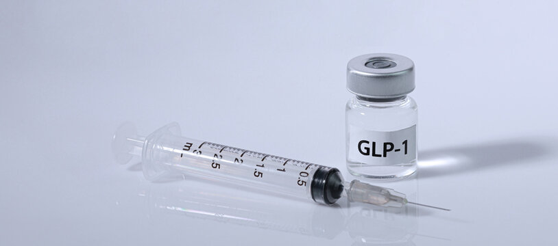 Clinical syringe and vial suggest hopeful medical weight management treatment, offering clear solution for patient health