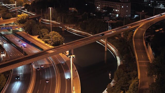 Traffic flow on the elevated overpass and moat of Beijing's Second Ring Road at night