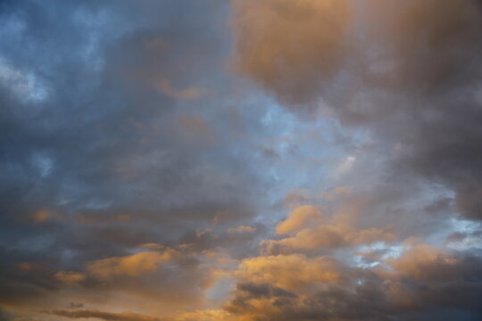 Golden clouds glow in a dramatic sky.