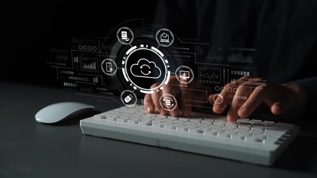 Conceptual image of a person typing on a keyboard with holographic cloud technology and data analysis graphics overlaying the scene, illustrating modern digital communication. Entropy.