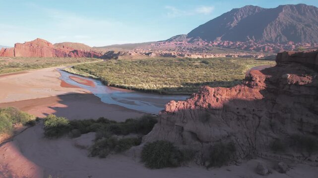 4K drone aerial view of Las Ventanas in Cafayate, Salta, Argentina. Unique red rock formations with natural openings shaped by erosion in the dramatic Quebrada de las Conchas landscape.