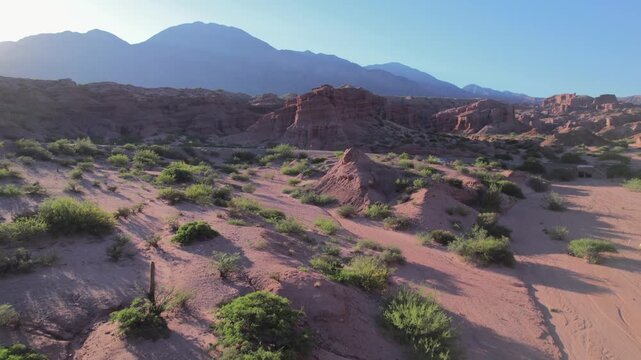 4K drone aerial view of Las Ventanas in Cafayate, Salta, Argentina. Unique red rock formations with natural openings shaped by erosion in the dramatic Quebrada de las Conchas landscape.